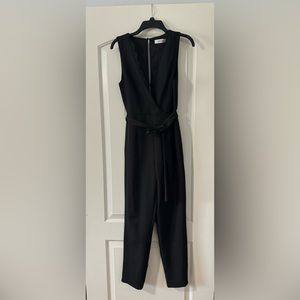 Black laced DoBe jumpsuit. Size small. Back zipper.